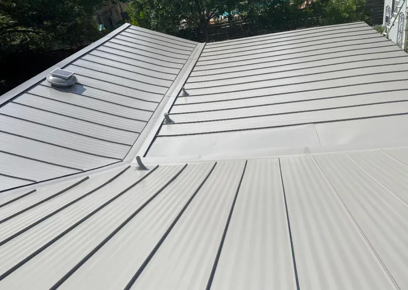 Solar attic fan installed on a metal roof for Roof Ventilation in Sedona